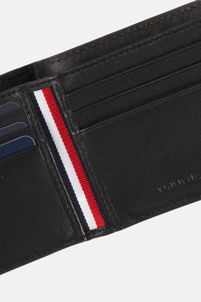 Portefeuille noir en cuir de TOMMY JEANS, rayures décoratives bleu marine, blanc et rouge.