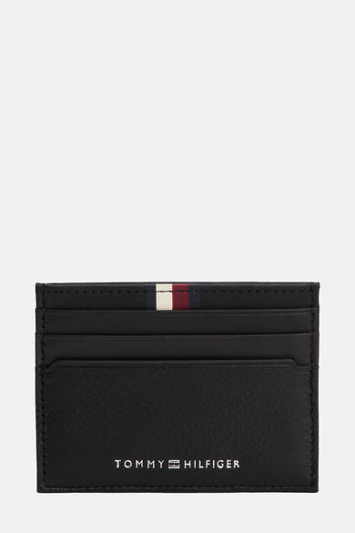 Porte-monnaie noir en cuir by TOMMY JEANS avec la rayure signature tricolore.