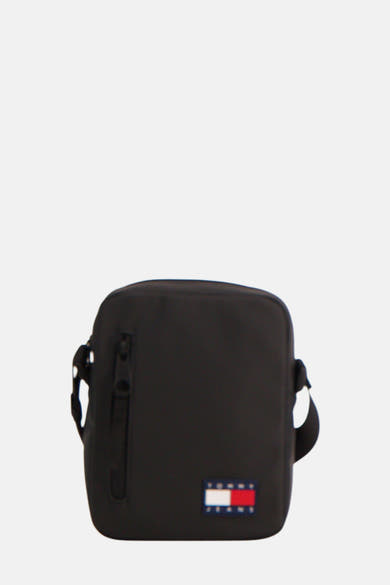 Zwarte schoudertas van TOMMY JEANS met ritssluiting aan de voorkant en merklogo.