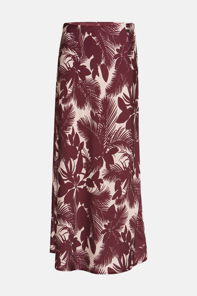 Jupe longue multicolore de AMELIE ET AMELIE avec motif feuilles tropicales bordeaux sur fond beige.