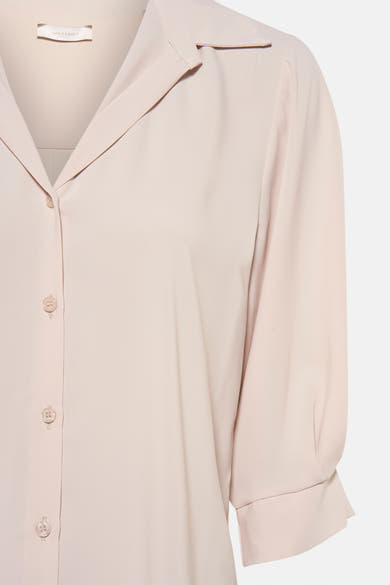Beige blouse met korte mouwen van AMELIE ET AMELIE, met ton-sur-ton knopen.