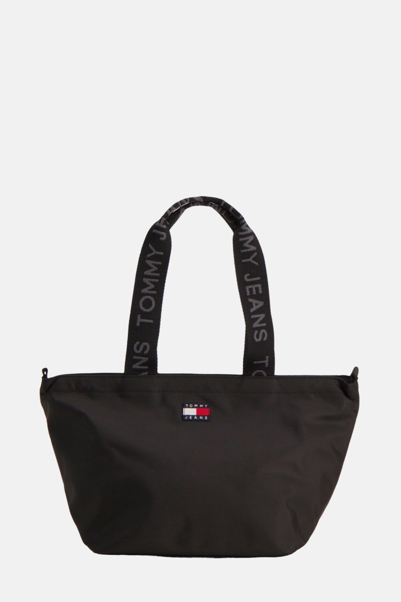 Sac à bandoulière noir de TOMMY JEANS avec des anses à lettrage et un logo sur le devant.
