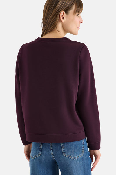 Paars sweatshirt van CECIL, lange mouwen, gedragen met een blauwe jeans, achterzicht.