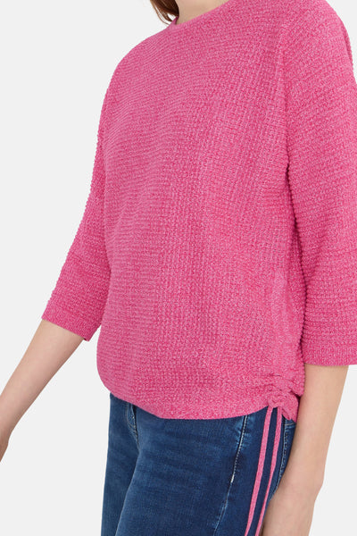 Roze gebreide trui van CECIL, met driekwartmouwen en een strikkoord aan de zijkant.