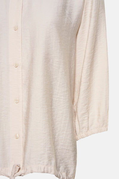 Chemisier à manches longues beige de CECIL, avec boutons et texture subtile.