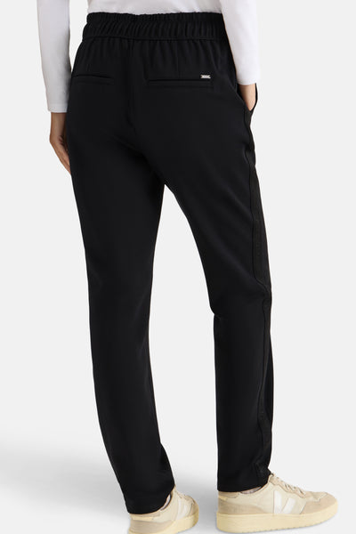 Pantalon de costume noir CECIL à taille élastique, avec détail de bande décorative sur le côté.
