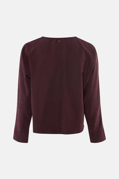 Blouse violette à manches longues de AMELIE ET AMELIE, vue dos, en tissu doux avec ourlet côtelé et petit logo discret au col.