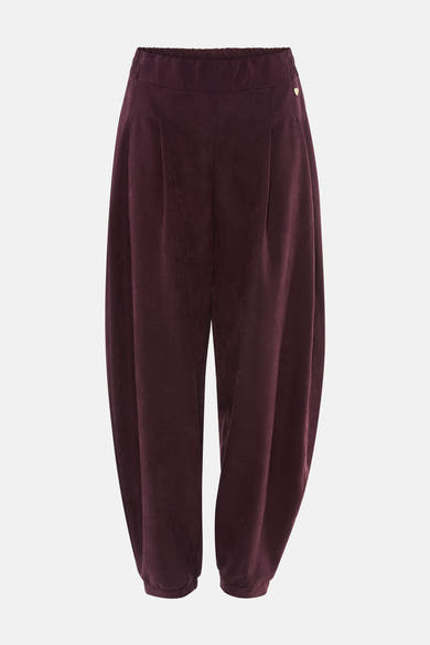 Pantalon violet en velours élastique par AMELIE ET AMELIE, coupe ample avec ourlet élastiqué et détail cœur doré sur côté