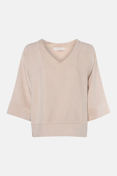 Ecru long-sleeve blouse with V-neck and ribbed texture by Amélie & Amélie, front view, cropped hem and cuffs