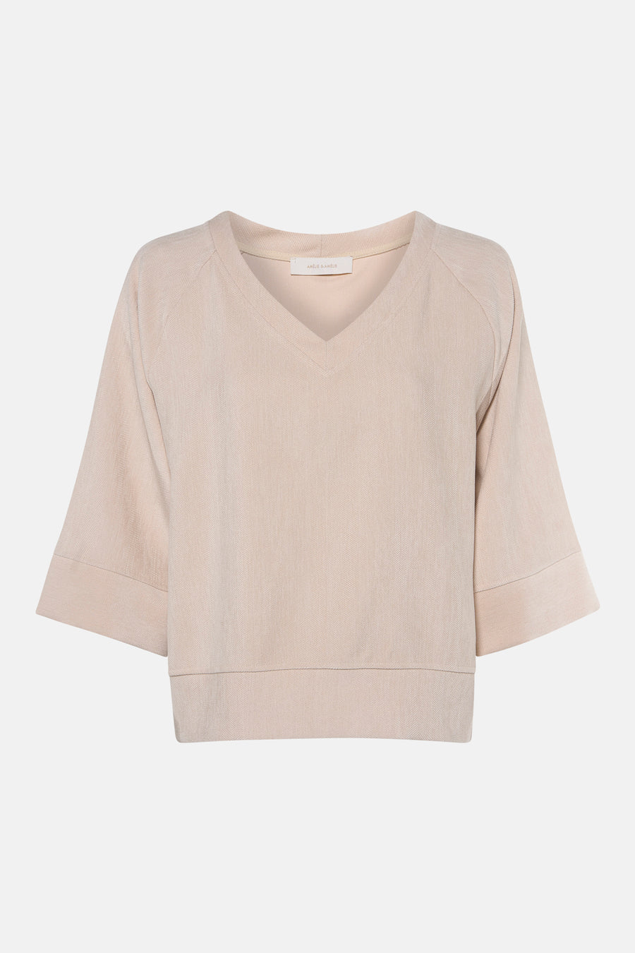 Ecru long-sleeve blouse with V-neck and ribbed texture by Amélie & Amélie, front view, cropped hem and cuffs