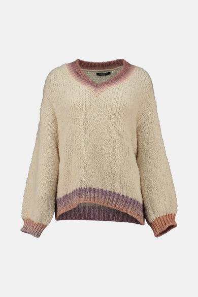 Pull à col en V beige de Zabaione, avec bordure rose et violette en bas et au niveau du col.