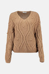 Pull à col en V cognac de Zabaione, avec motif torsadé sur l'ensemble du vêtement et détails en maille bouffante.