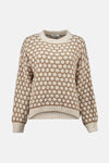 Pull à col rond multicolore de ZABAIONE, avec un motif à pois contrastants et une texture tricotée.
