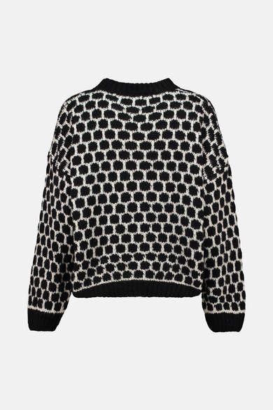 Pull noir à col rond de Zabaione avec motif géométrique noir et blanc.