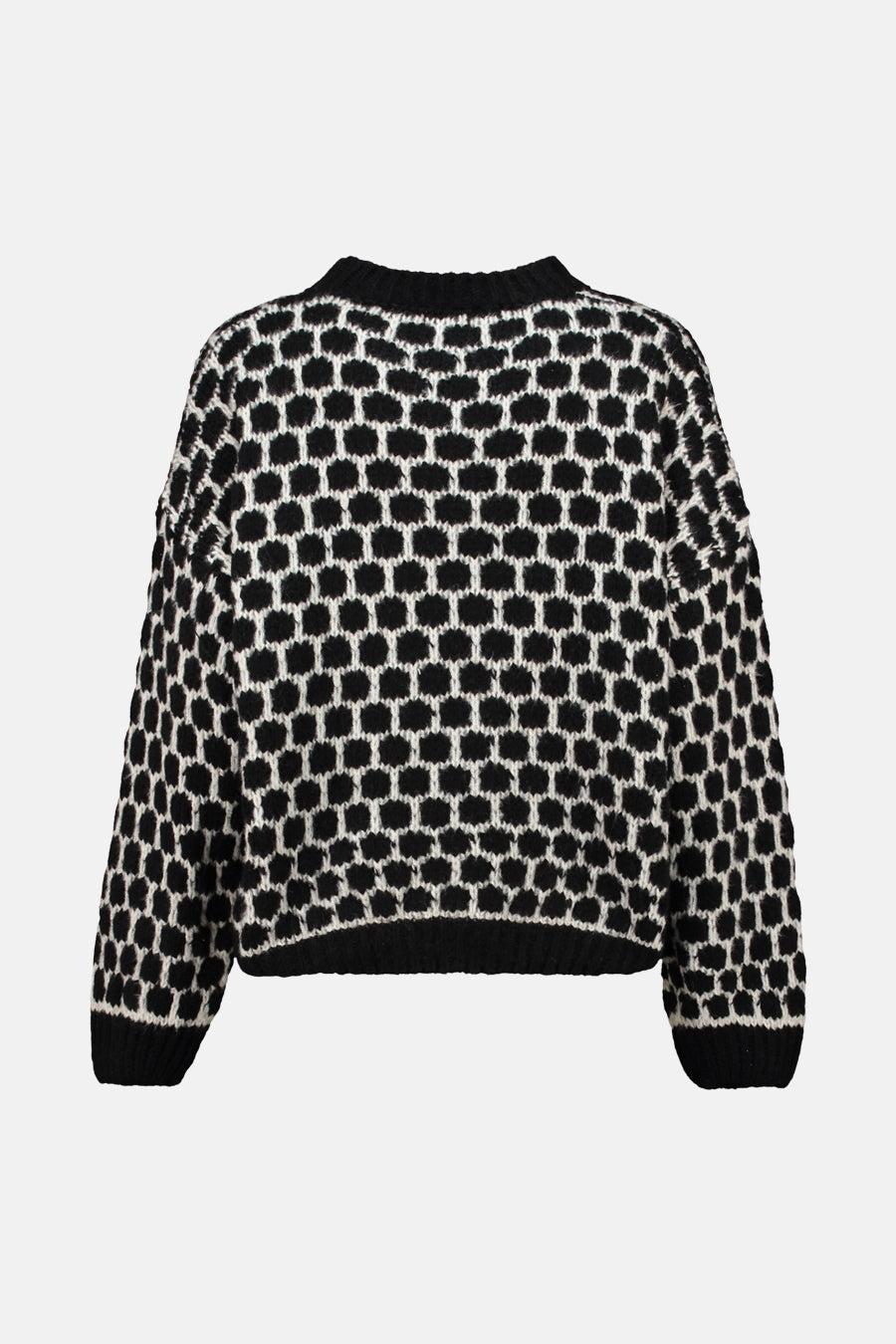 Pull noir à col rond de Zabaione avec motif géométrique noir et blanc.
