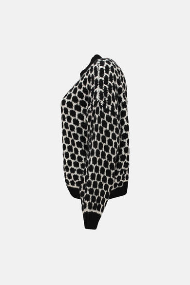 Pull à col rond noir de ZABAIONE avec un motif à pois contrastant.