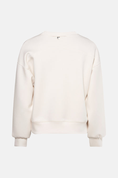 Ecru sweatshirt van AMELIE ET AMELIE, achterkant met zilveren hartdetail op de nek.