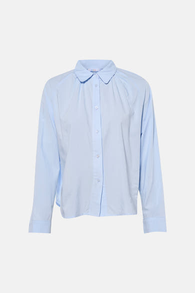 Chemise bleue à manches longues par ADORE, avec col arrondi et fermeture boutonnée sur le devant.