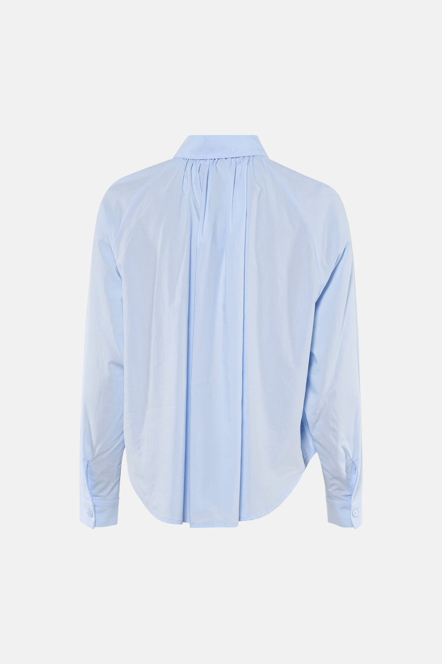 Chemise bleu clair de ADORE avec manches longues et plis au dos.