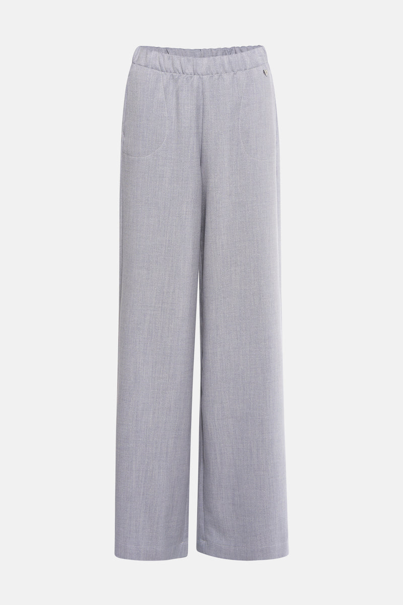 Gemêleerde blauwe broek van AMELIE ET AMELIE, met een decoratief metalen hartdetail.