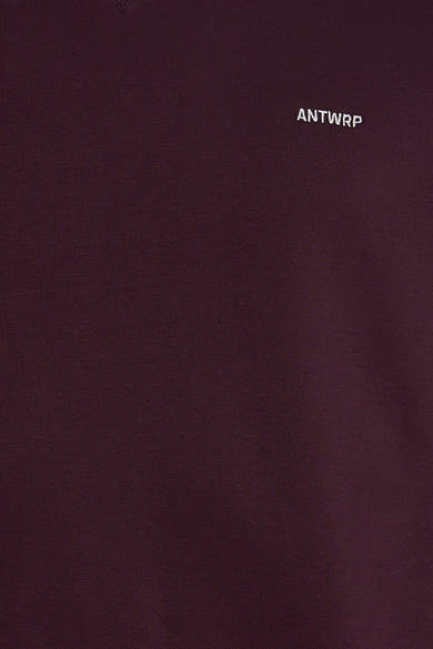Bordeaux O-neck sweatshirt by ANTWRP with small white embroidered logo on chest, close-up view