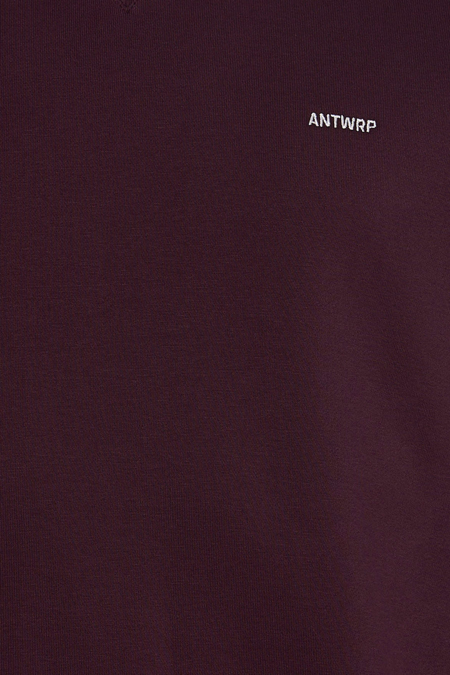 Bordeaux O-neck sweatshirt by ANTWRP with small white embroidered logo on chest, close-up view