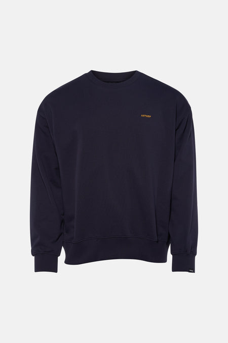 Blauwe sweater van ANTWRP, met logo op de borst en geribbelde afwerkingen.