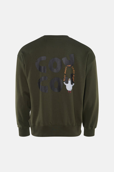 Kaki sweatshirt van ANTWRP, met "don't annoy the crazy pigeon" print op de rug.