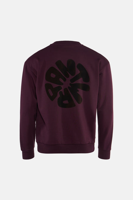 Bordeaux crewneck sweatshirt with black circular graphic print on back, ribbed cuffs and hem, back view