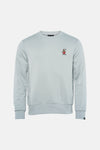 Sweat-shirt bleu de ANTWRP avec un motif bol de nouilles brodé sur la poitrine.