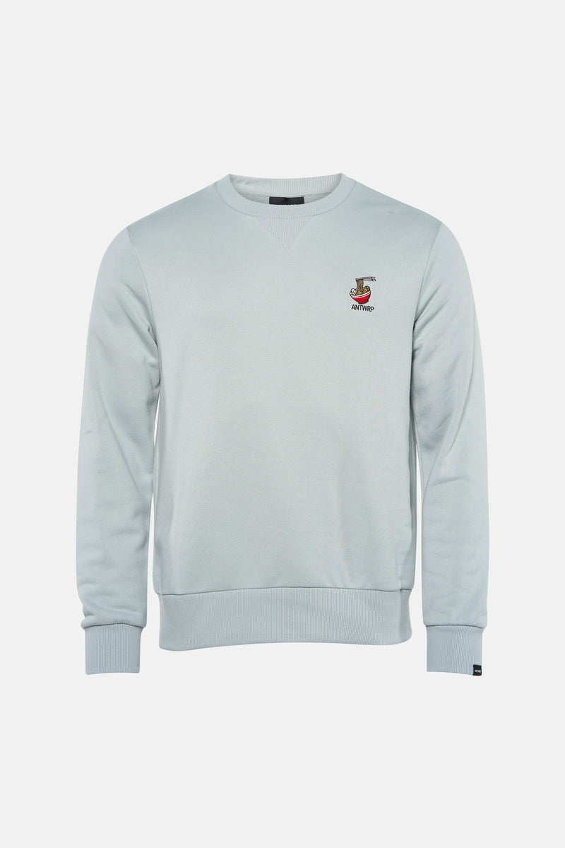 Sweat-shirt bleu de ANTWRP avec un motif bol de nouilles brodé sur la poitrine.
