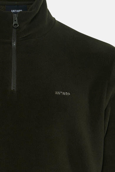 Olive green fleece pullover with half-zip collar by ANTWRP, featuring subtle embroidered logo on chest, soft textured fabric, close-up front view.