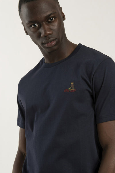 Navy blue short-sleeve t-shirt with small owl and "ANTWERP" embroidery on chest, worn by model in front view