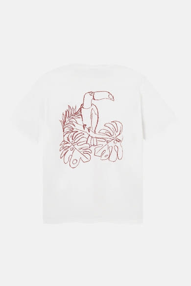 T-shirt blanc à manches courtes par ANTWRP, avec un dessin de toucan et des feuilles tropicales au dos.