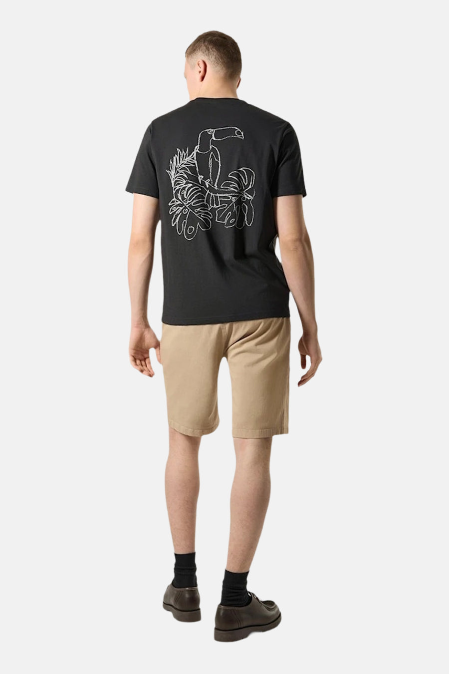 T-shirt noir à manches courtes par ANTWRP avec un motif brodé d'un toucan au dos.