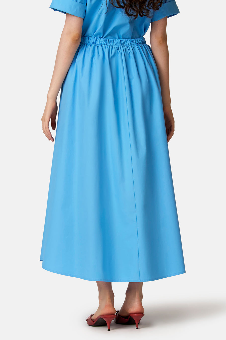 Jupe longue bleue de COPINES D'ANVERS à taille élastiquée, coupe évasée, vue de dos.