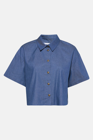 Middenblauwe denim blouse van NAF NAF, met gouden knopen.
