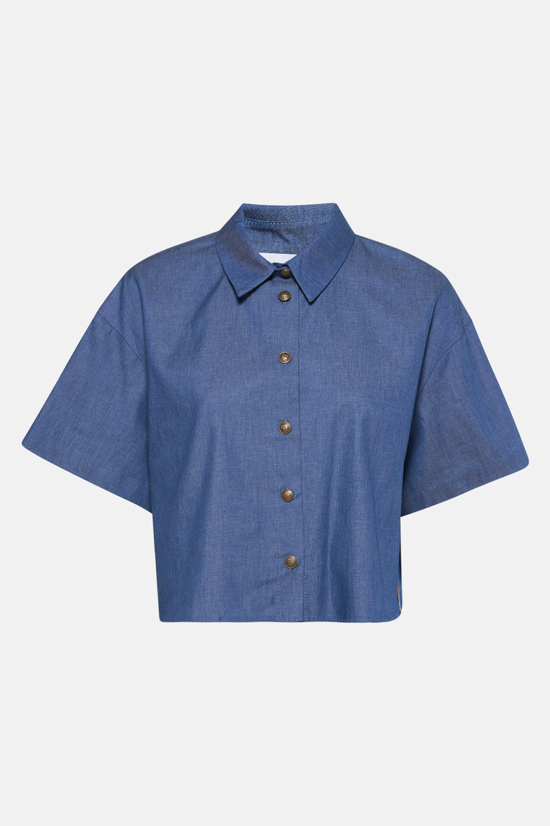 Middenblauwe denim blouse van NAF NAF, met gouden knopen.