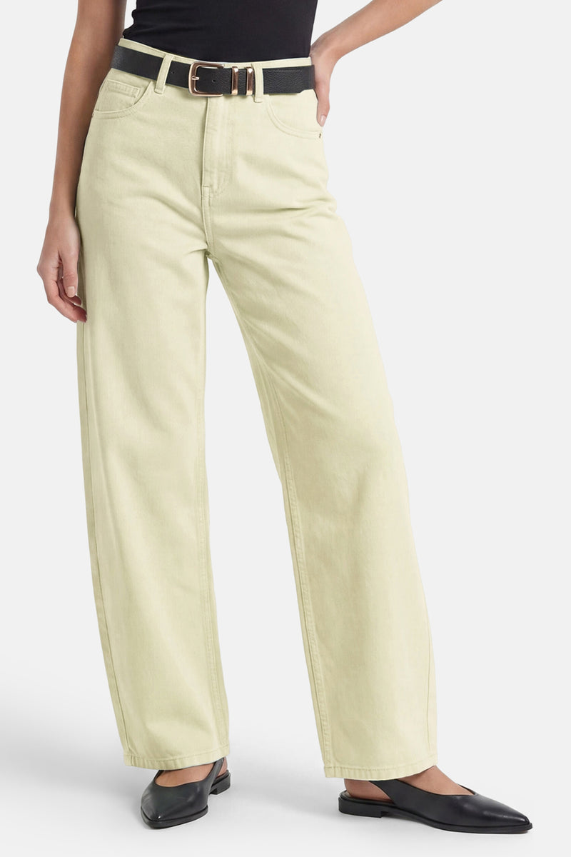 Light green women's five-pocket straight-leg pants with belt loops, worn with black top and shoes, front view