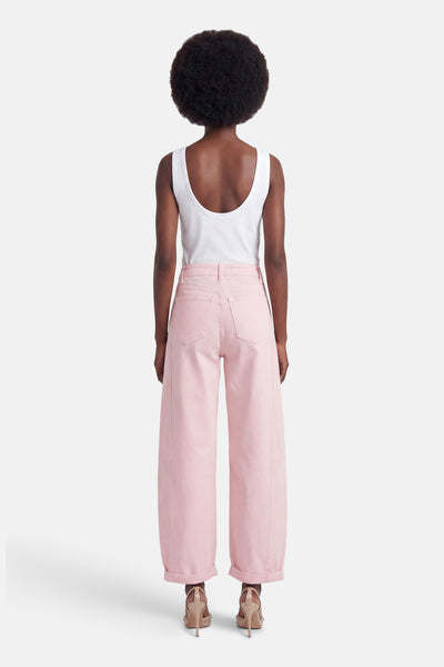 Rose wide-leg five-pocket trousers with cuffed hems, shown from back on model wearing white tank top and heels