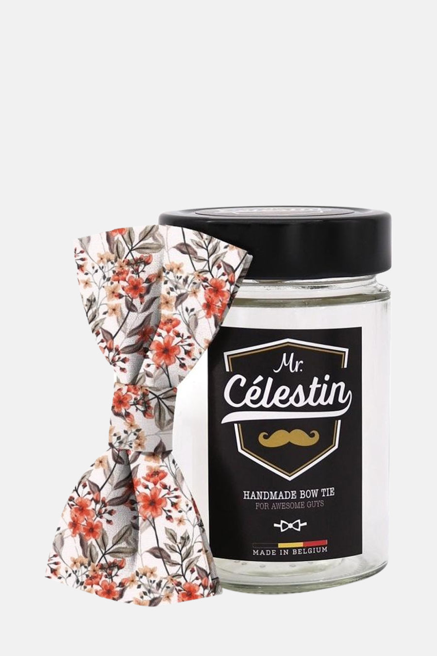 Nœud papillon multicolore de Mr. Celestin avec imprimé floral et présenté dans un bocal en verre.
