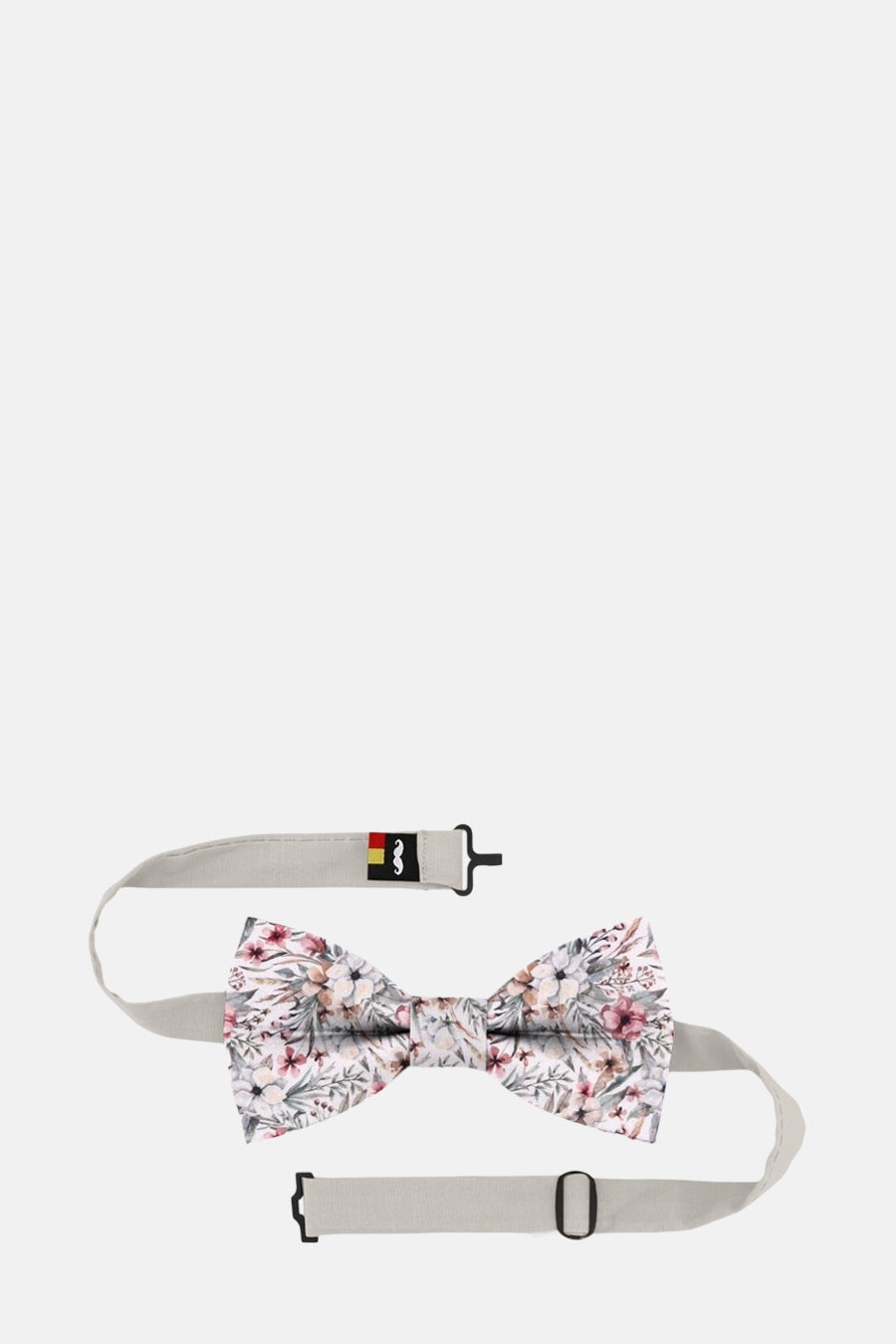 Nœud papillon multicolore de MR. CELESTIN avec motif floral sur fond blanc cassé et sangle beige.