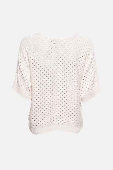 Pull écru en maille ajourée de Zabaione, manches courtes et coupe décontractée.