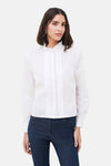 Chemise blanche à manches longues de CAROLL, avec plastron plissé et col montant à volants.