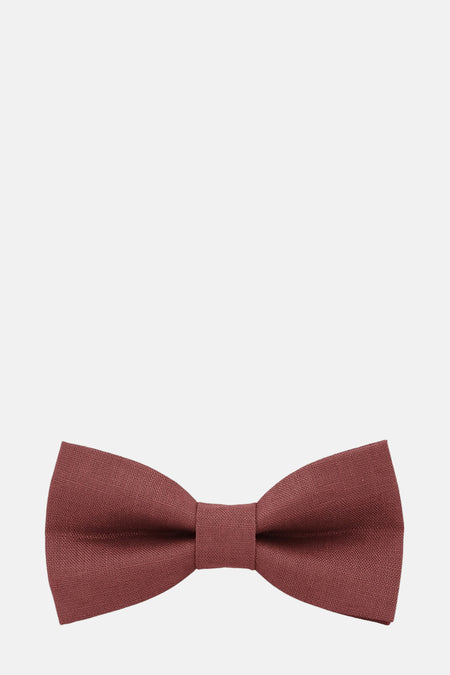 Noeud papillon orange de MR. CELESTIN sur fond uni.