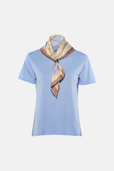 Light blue short-sleeve t-shirt with ribbed texture, featuring a floral and striped scarf tied at the neck in beige and brown tones.