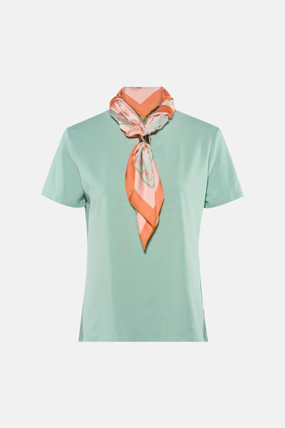 Mint green short-sleeve t-shirt with ribbed texture, styled with peach and floral scarf tied at neckline, front view