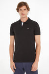 Polo noir de Tommy Jeans avec patte de boutonnage tricolore et logo discret.