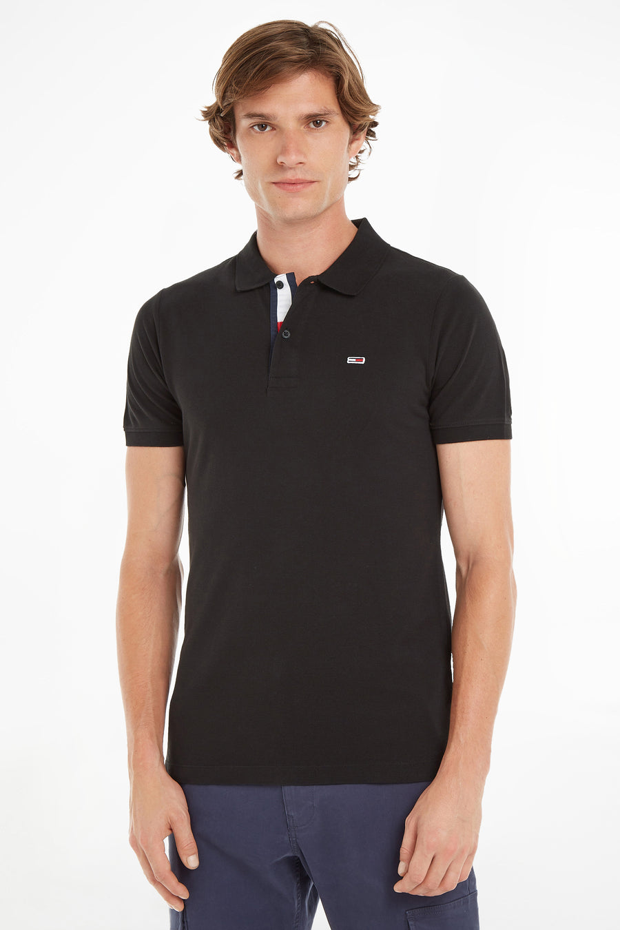 Polo noir de Tommy Jeans avec patte de boutonnage tricolore et logo discret.