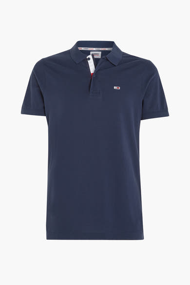 Polo bleu marine de Tommy Jeans, avec des détails tricolores au col et un logo discret.